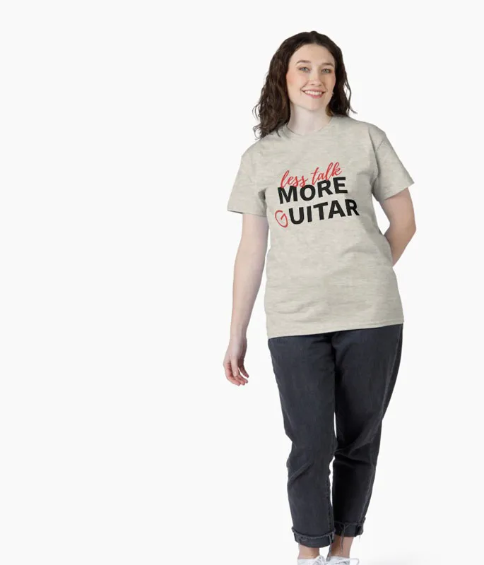 Female model wearing a T-shirt that says "Less Talk. More Guitar".