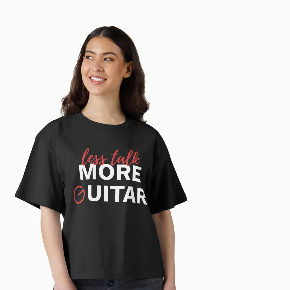 Female model wearing a T-shirt that says "Less Talk. More Guitar".