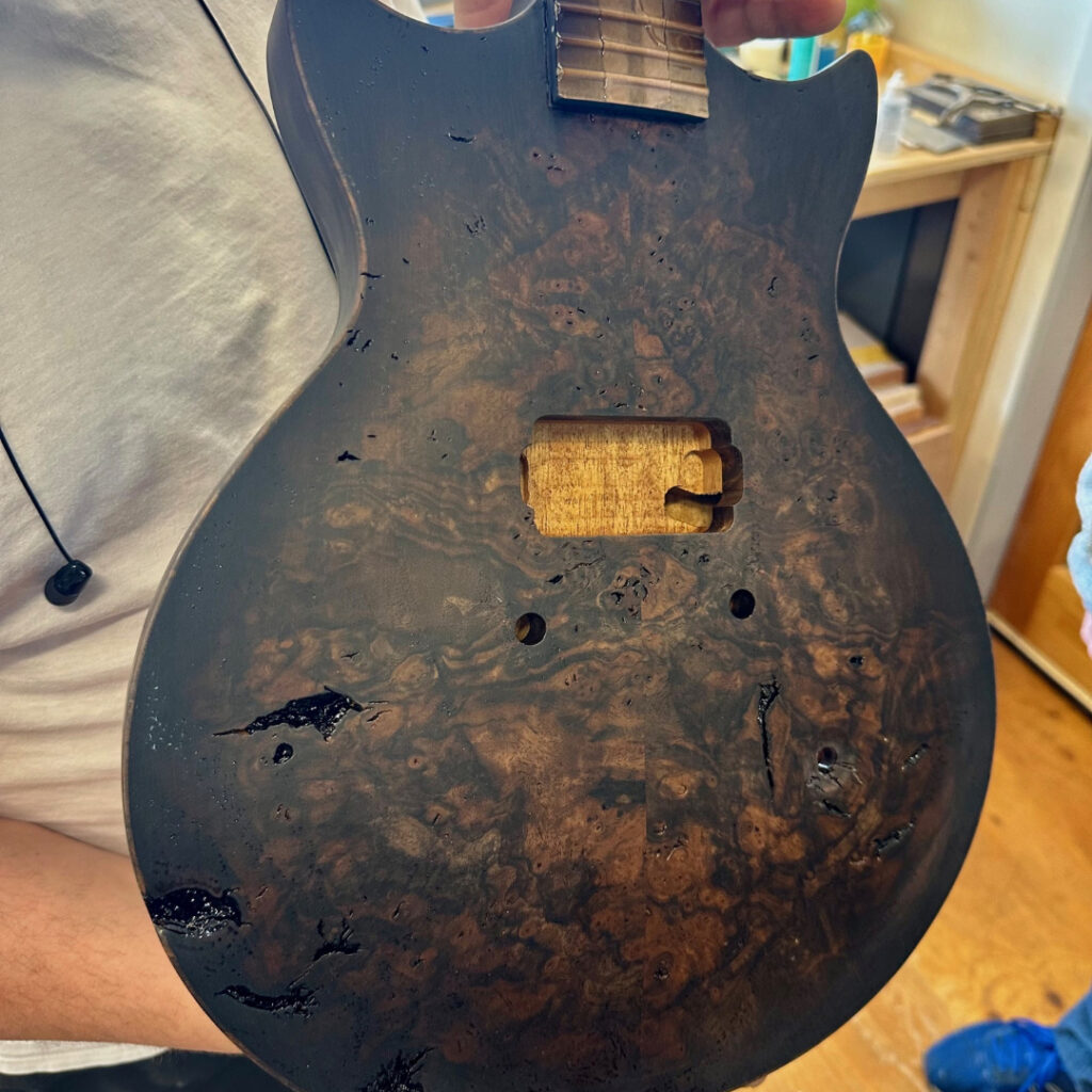 Burst and sealer sanding. Open pores treated.
