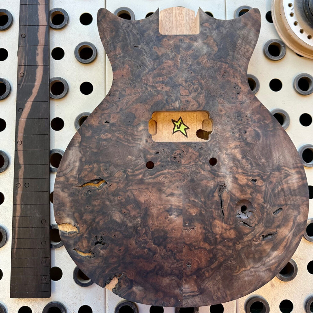 Guitar body and fretboard initial stages.